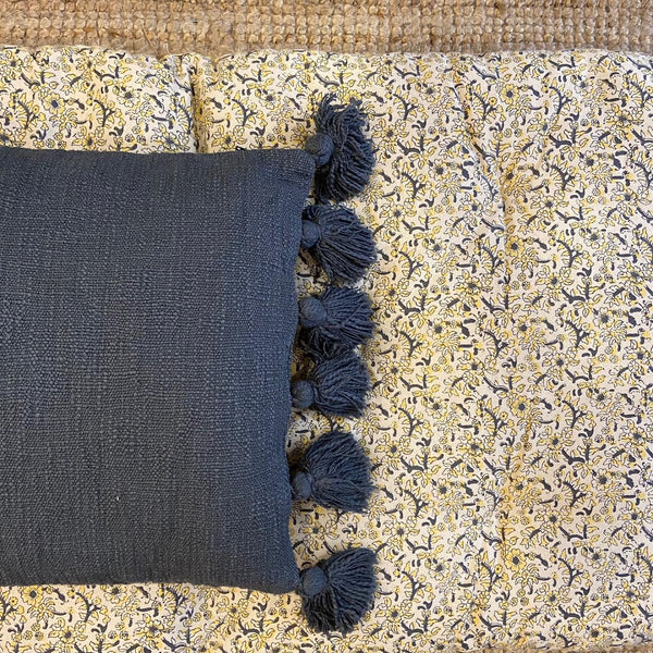 Cotton cushion cover with pompoms